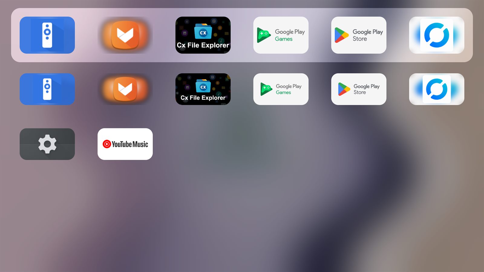 Pustaka aplikasi: grid app di atas latar kabur.